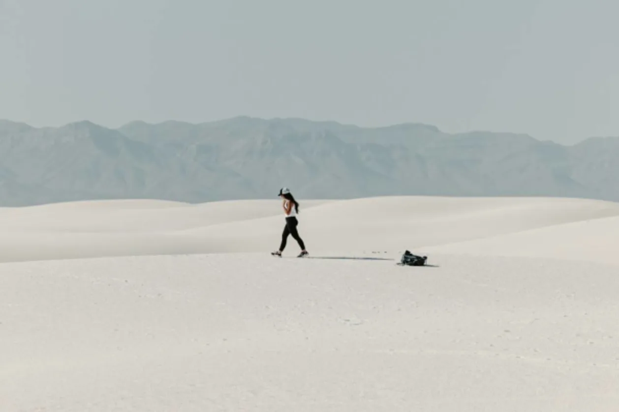 Solo female traveler walking in white sands national park